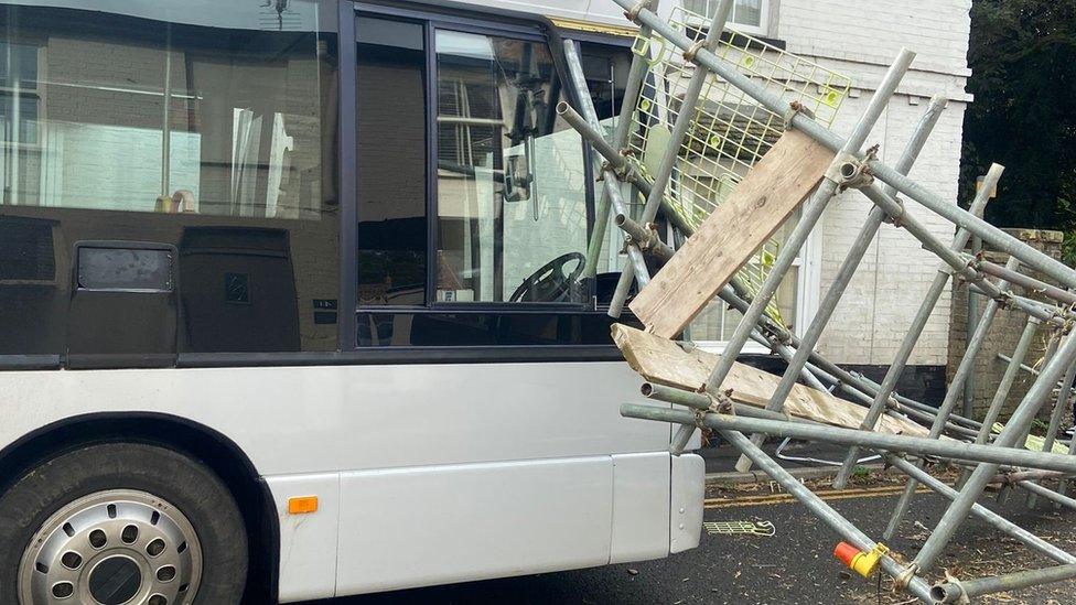 Fallen scaffolding on bus