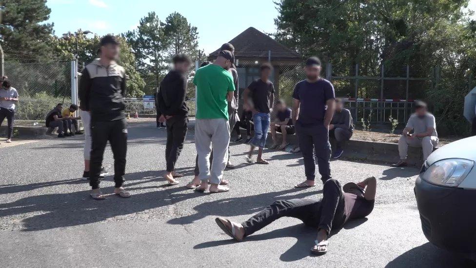 Group of men staging a protest in a road