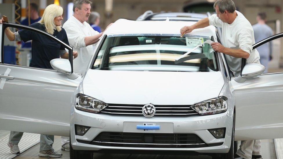 workers on a VW production line