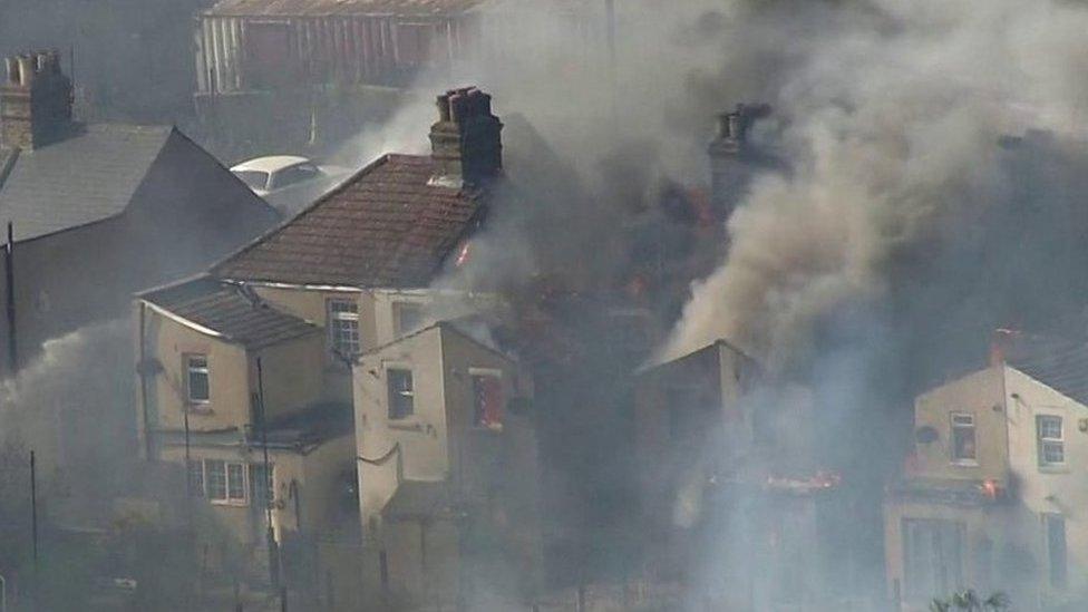 Smoke pouring from a home