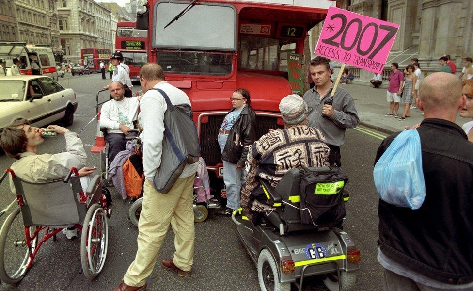 DAN hold up a bus outside Downing Street