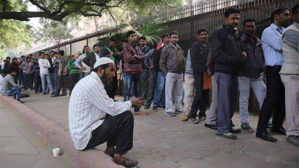 Indian people line up to change old Indian rupee notes outside the Reserve Bank of India in New Delhi, India, 02 December 2016.