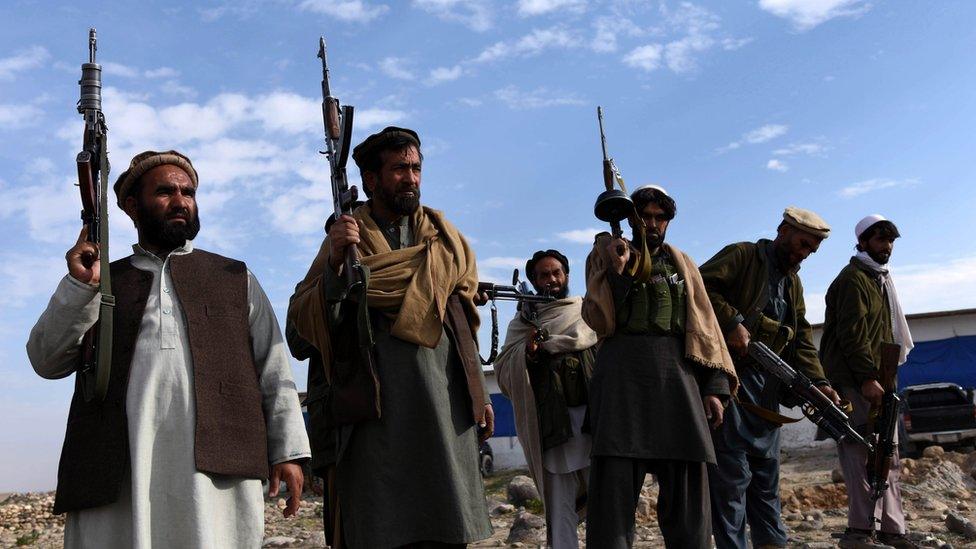 Pro-government forces stand guard at a check post in Achin district of Nangarhar province, Afghanistan, 27 December 2015