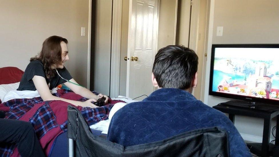 Chris Taylor playing the video game Smash Bros. Ultimate.