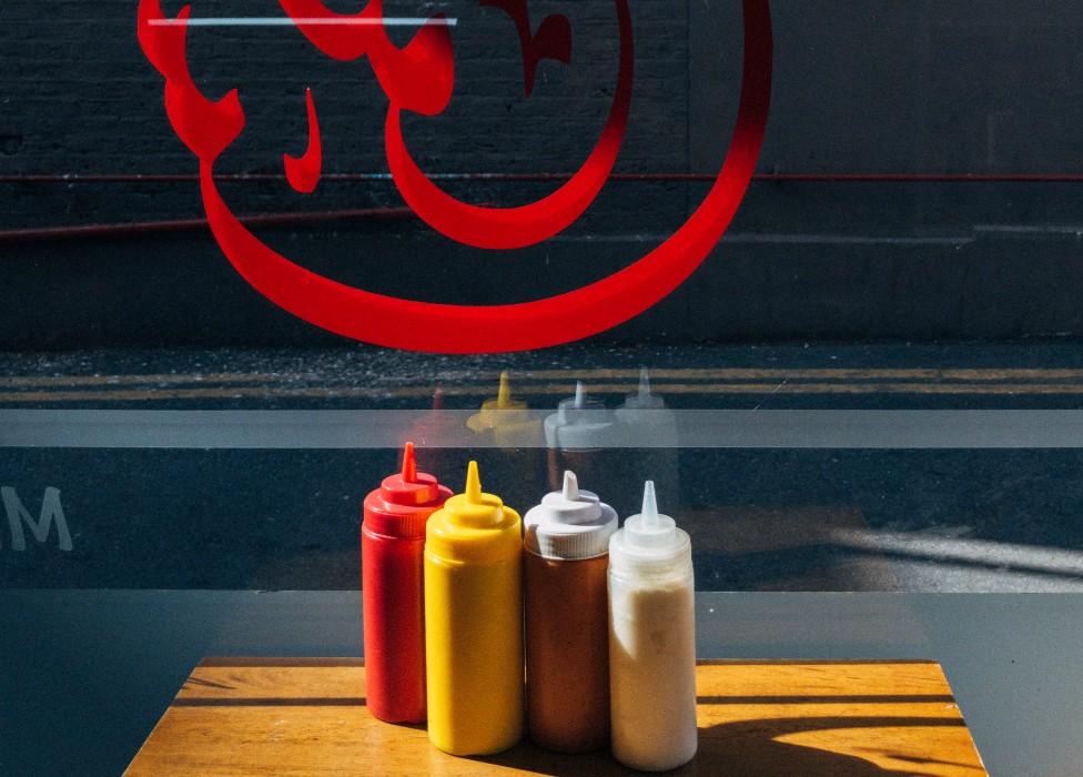 Sauce bottles in the window of Mannoush, a Lebanese restaurant, in Walthamstow, east London