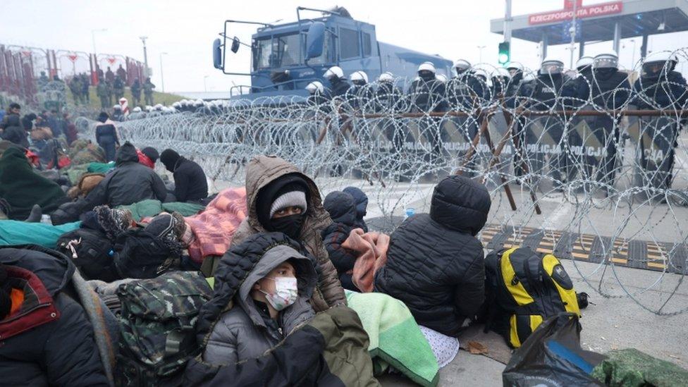 Migrants gather on the Belarusian-Polish border in an attempt to cross it,