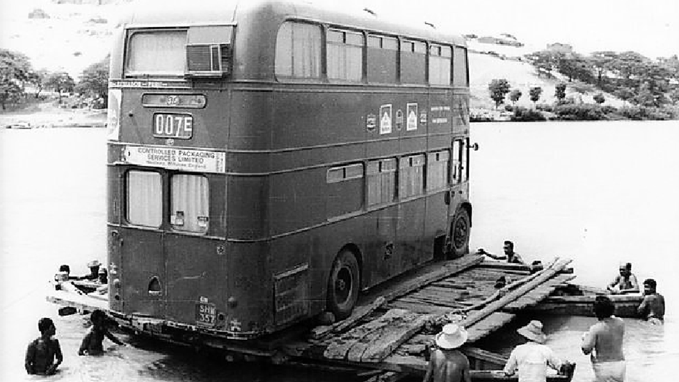 Bus on raft on River Chira, Peru