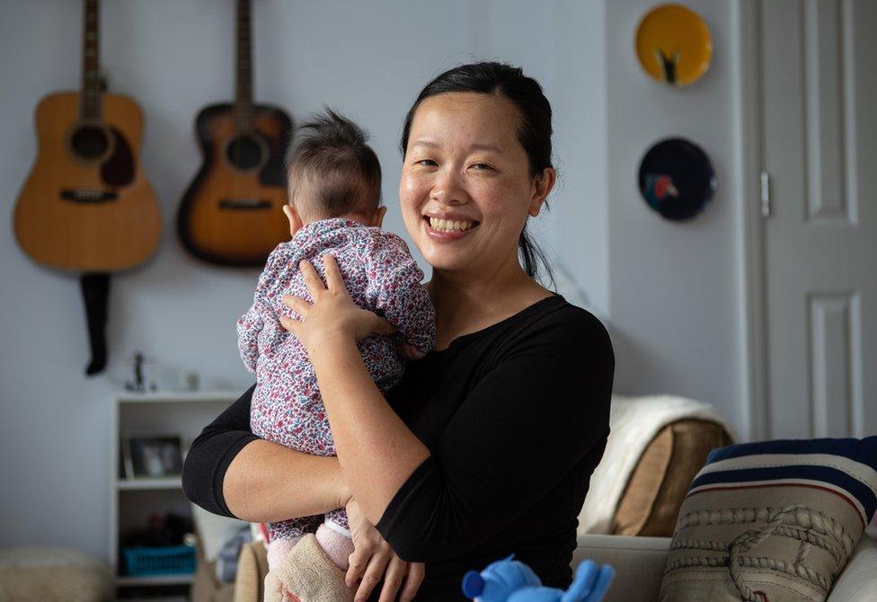 A portrait of Amy with her baby daughter Elowen