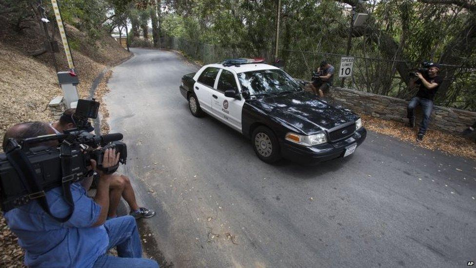 A police car leaves through the gate of Demi Moore's house in Los Angeles. Photo: 19 July 2015