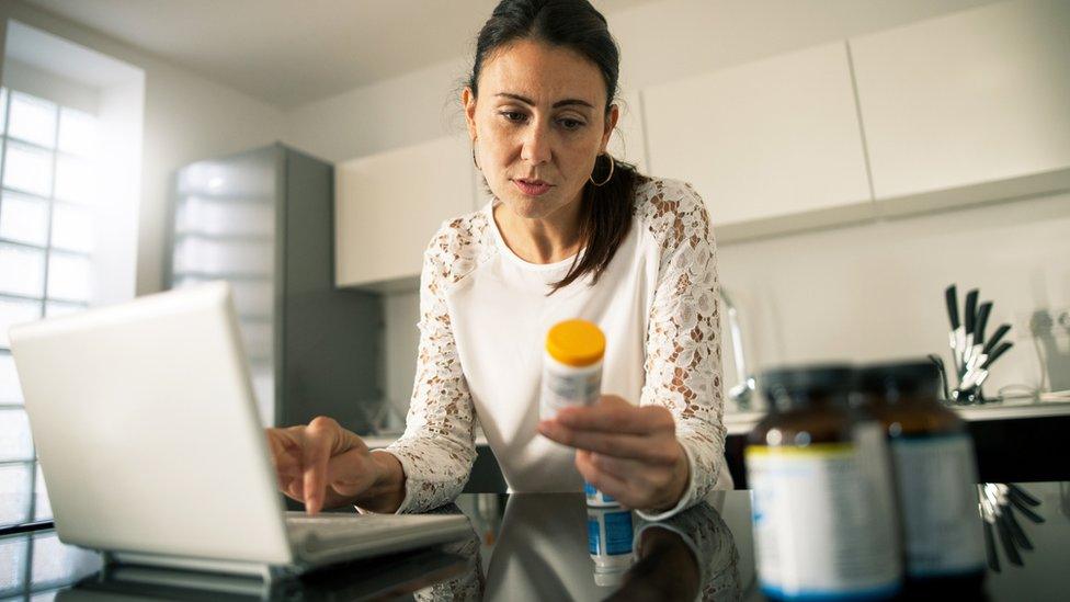 A woman buying drugs online