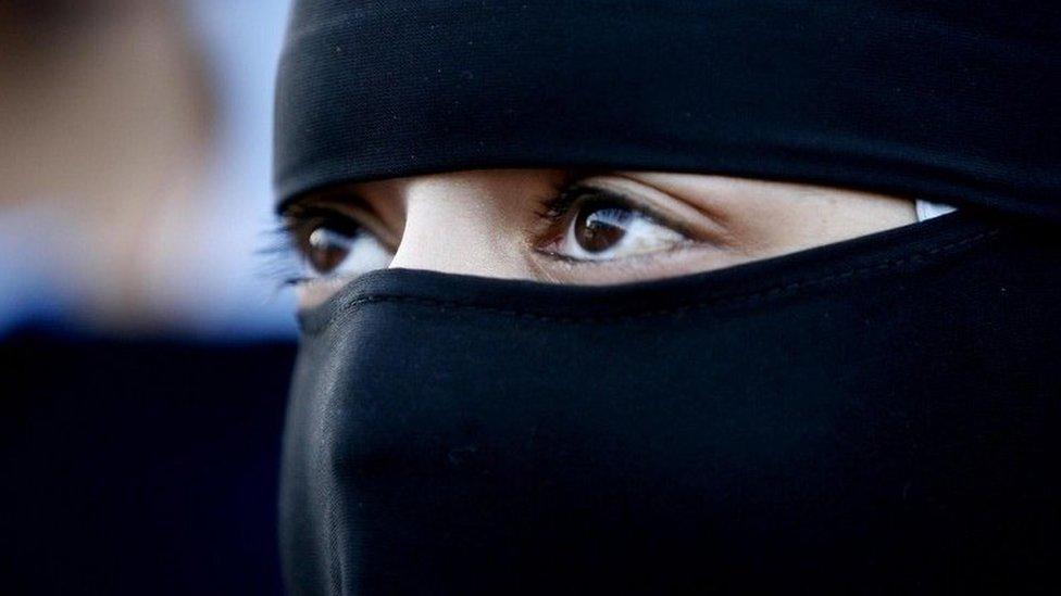 A Muslim woman wearing a niqab