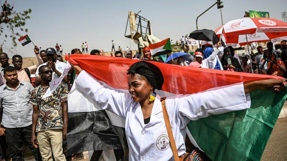 Woman holds a flag