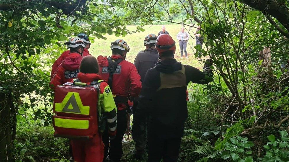 Emergency services take man to helicopter