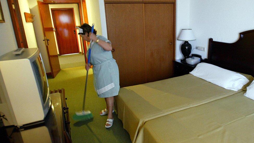 Cleaning lady works in a room of Spanish RIU group's 'Oliva Beach' hotel in Corralejo, on Fuerteventura Island, Spain, December 2004.