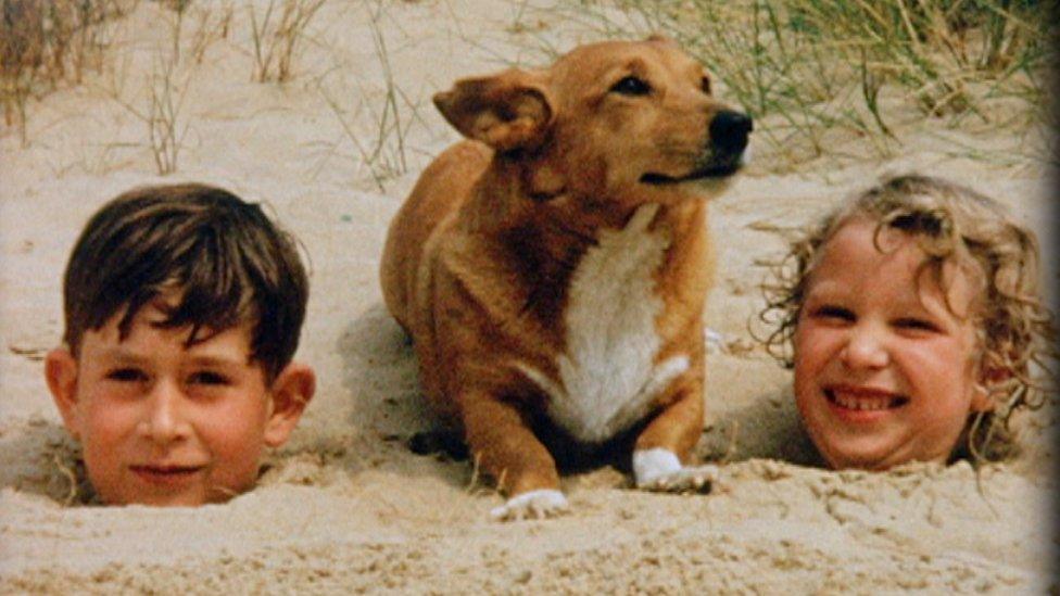 Prince Charles and Princess Anne with a corgi at Holkham Beach, near Sandringham, in 1957