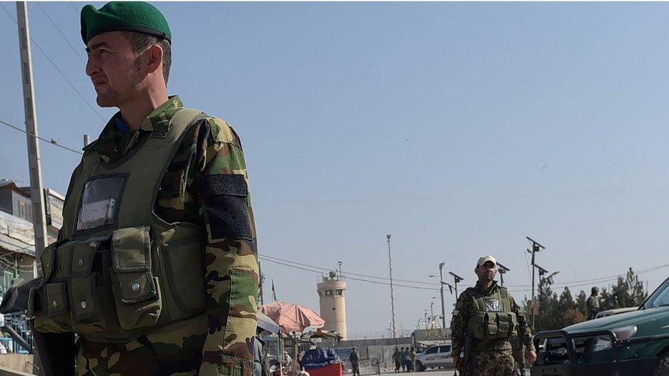 Afghan security personnel keep watch near the largest US military base in Bagram, 50 km north of Kabul, after an explosion on November 12, 2016.