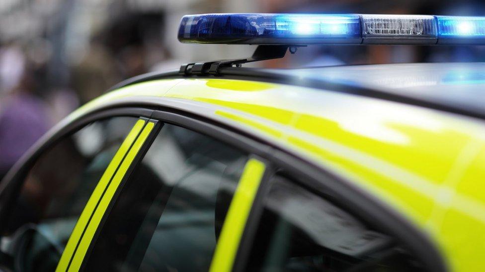 A police car with its lights flashing
