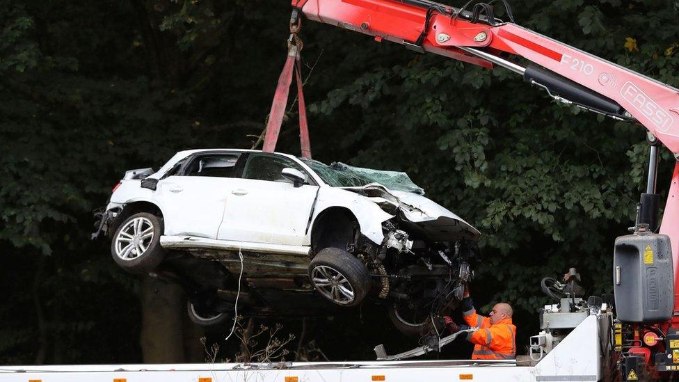 Car craned off road after fatal crash which killed two people