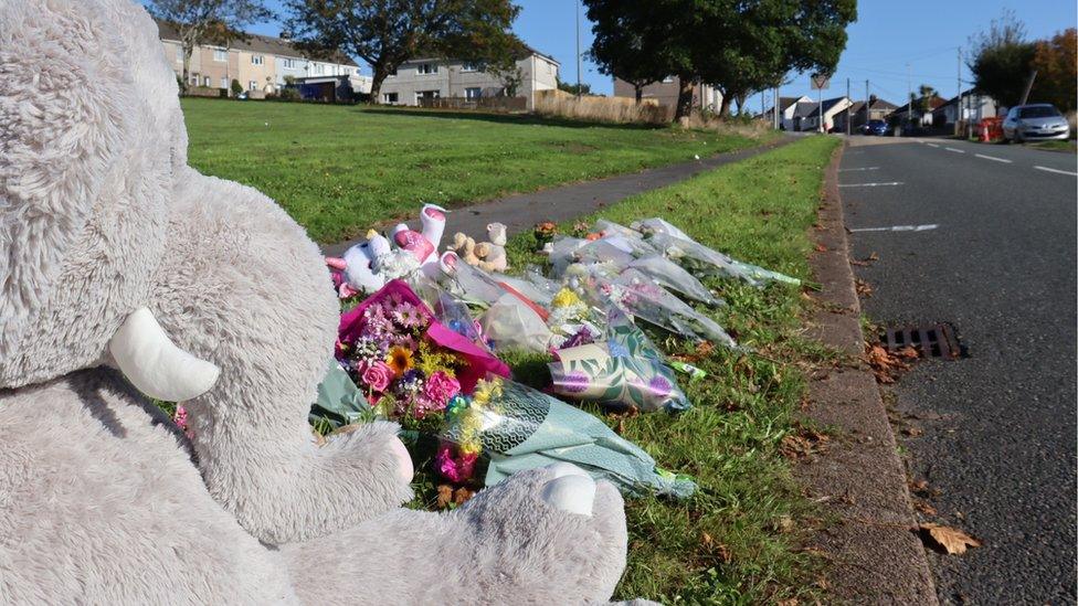 Flowers and tributes by roadside