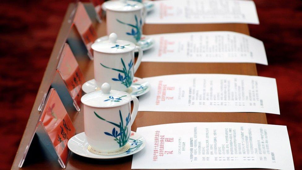 Cups of tea and agendas lined up on a table, 19th Congress of the Chinese Communist Party