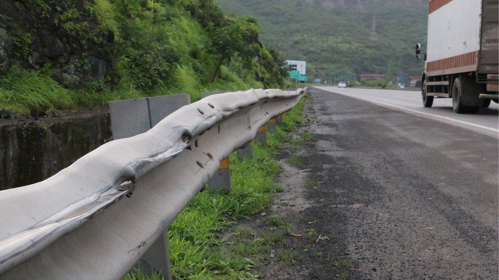 Battered motorway barrier on the Pune-Mumbai expressway