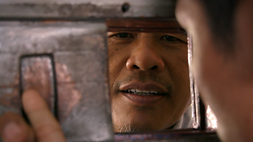 Ali Fauzi at a prison gate