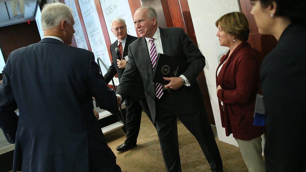 CIA Director John Brennan (C) greets colleagues after delivering remarks at the Center for Strategic and International Studies November 16, 2015 in Washington, DC