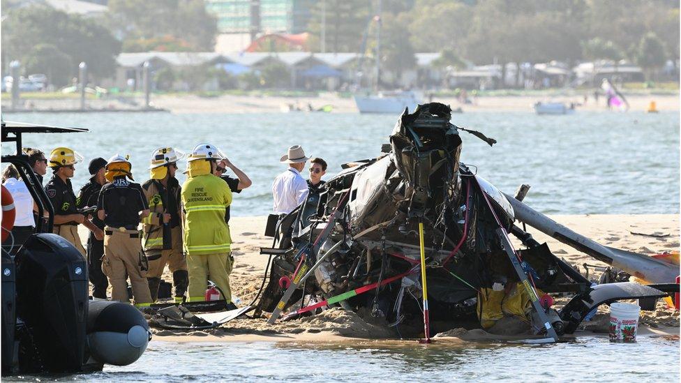 Emergency personnel at the scene of the collision