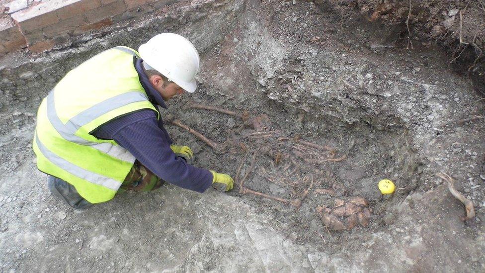 An archaeologist excavates one of the skeletons in the Roman cemetery at Western Road