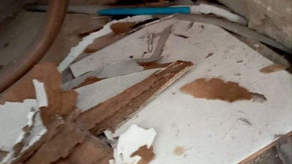 A collapsed ceiling caused by water damage