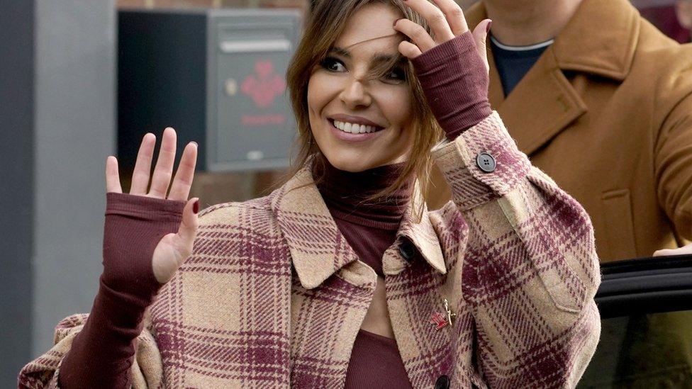 Cheryl waving to fans outside the Prince's Trust in Newcastle.