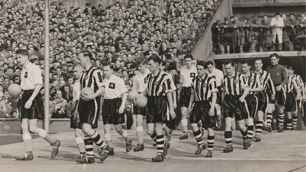 Robert 'Jock' Haugh is pictured in the black and white strip, second in line out of the tunnel