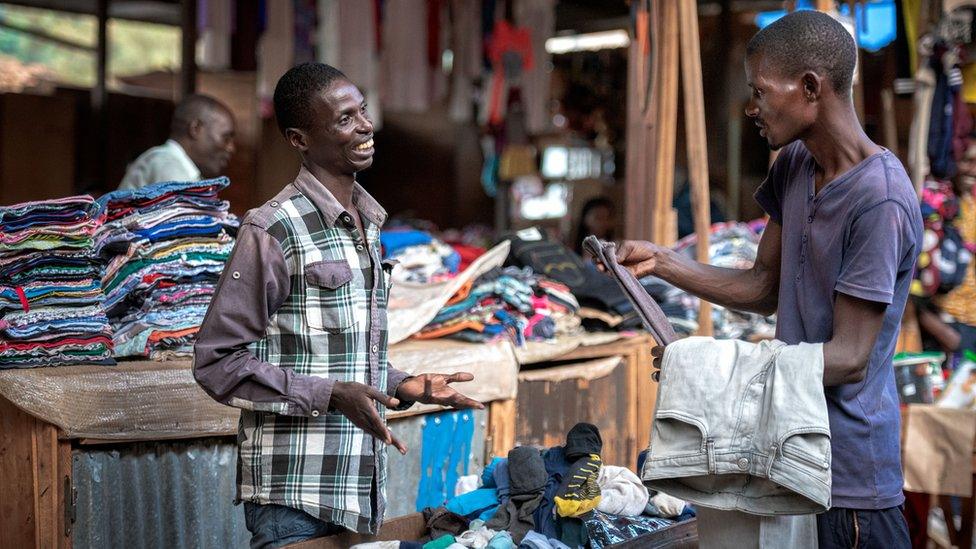 Rajabu Nzeyimana speaking to a customer