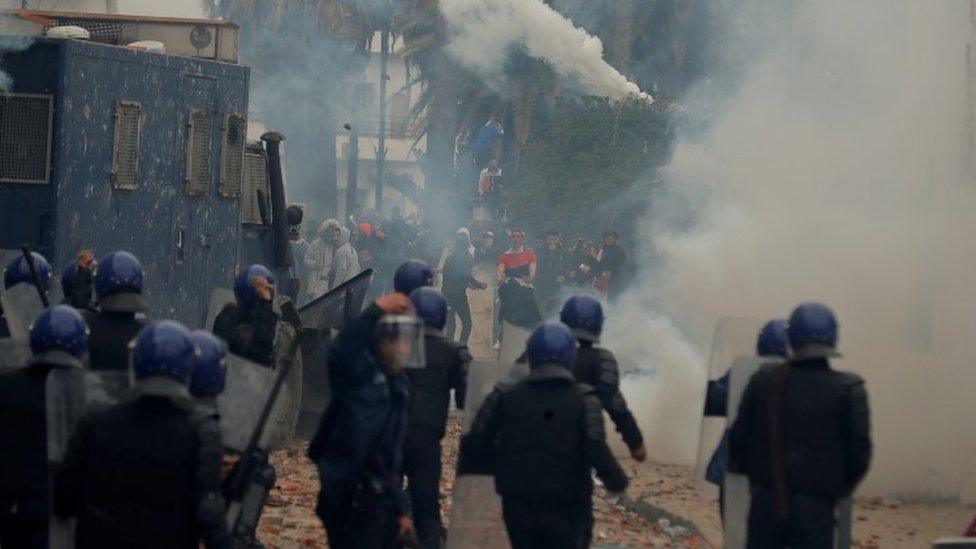 Anti-riot police officers clash with people protesting against President Abdelaziz Bouteflika, in Algiers, Algeria March 8, 2019