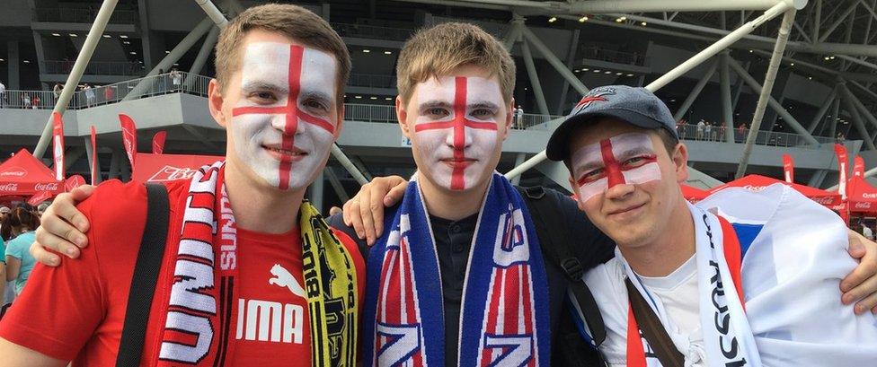 Russian fans with England flags daubed on their faces in Samara on 7 July