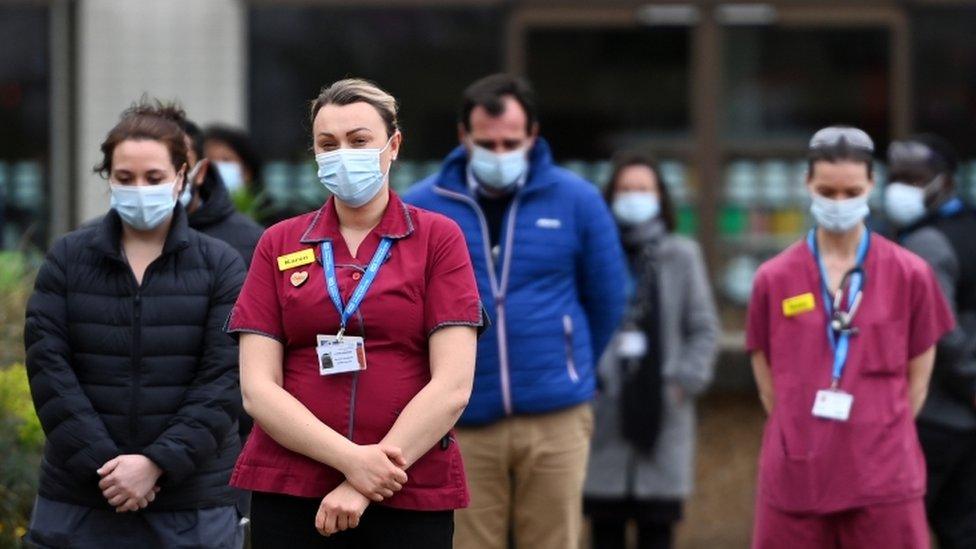 Nurses take part in a minutes' silence