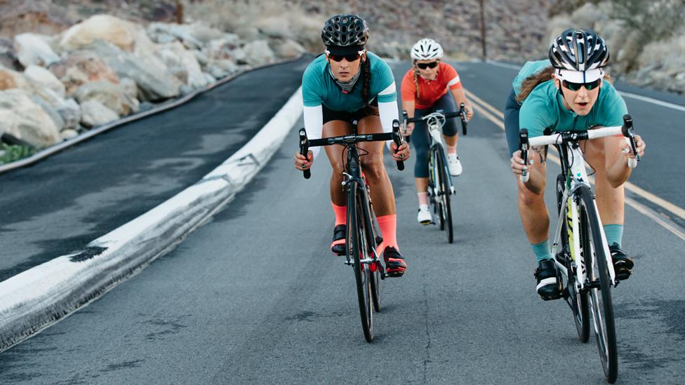 Female cyclists wearing Rapha clothing