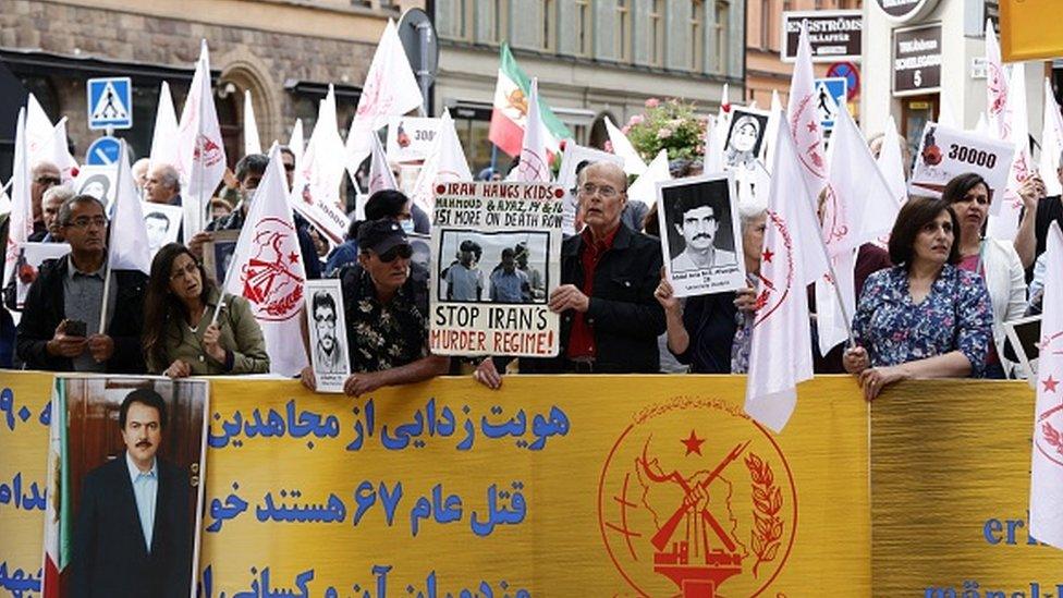 Supporters of an Iranian opposition group protest outside Stockholm's district court in Sweden