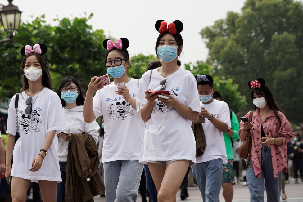 Visitors wearing protective face masks