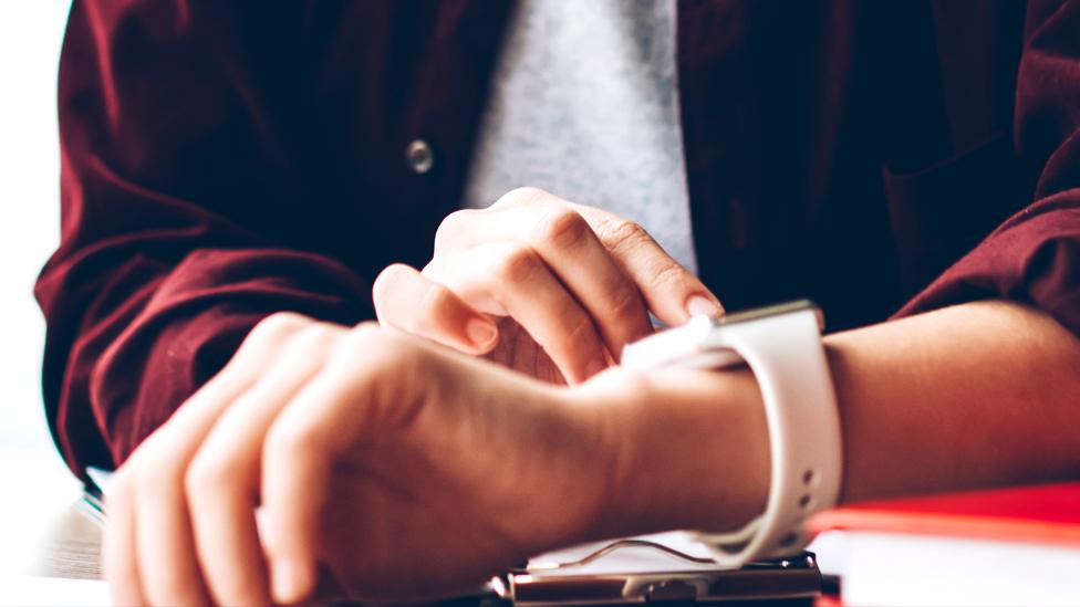 Person using smartwatch