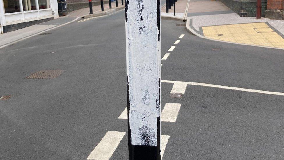 Paint on metal pole