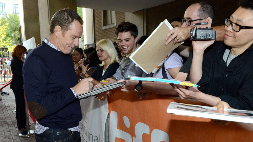 Bryan Cranston signing autographs