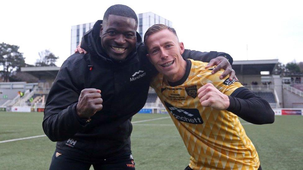 Maidstone manager George Elokobi and midfielder Sam Corne celebrate victory over Stevenage