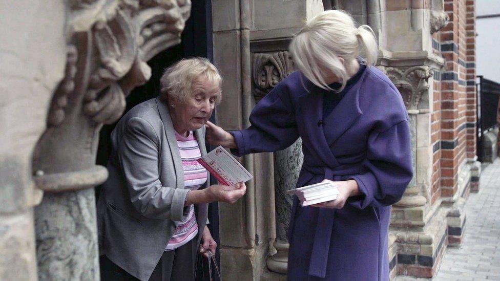 Anti-abortion campaigner in Belfast handing out leaflets