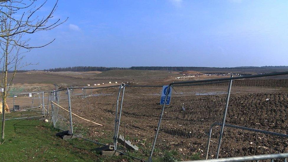 Much of the site is fenced off and lacks the planned cycle paths and walking routes