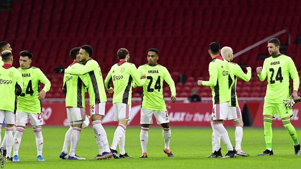 Ajax players wearing shirts in support of Cameroon goalkeeper Andre Onana