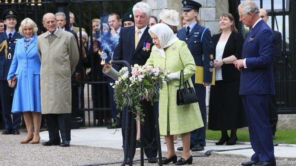 The Queen lighting a beacon