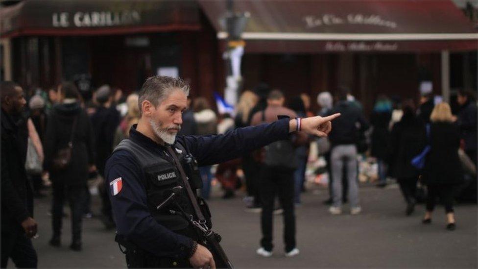 A police officer outside the Le Carillon restaurant