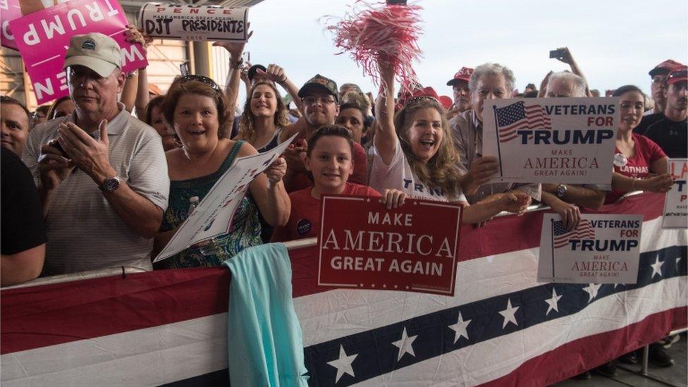 Supporters cheer US President Donald Trump during a rally at the Orlando Melbourne International Airport on 18 February, 2017 in Melbourne, Florida.