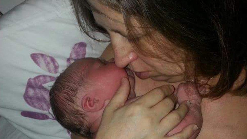 Samantha Gadsden and her youngest child on the day he was born